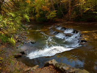 Wall Mural - A small tiered waterfall on the Chagrin River in the South Chagrin Reservation near Cleveland, Ohio