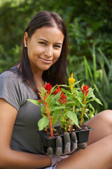 Wall Mural - Woman, portrait with flowers and garden in backyard, nature and sustainability with environment. Landscaping, gardener with plant in soil or fertilizer for growth, eco friendly and botanical outdoor