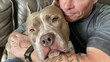 Comforting Human Embrace with American XL Bully Dog