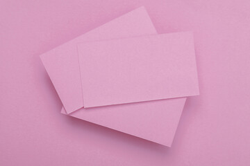 Wall Mural - Pink Blank business cards for corporate identity on pink background. Creative mockup.