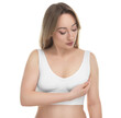 Mammology. Young woman doing breast self-examination on white background