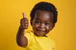 young child smiling doing thumbs up sign, ok sign, thumbs up sign, happy child, children's day, child protection, happy and healthy child