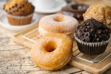 Wall Mural - glazed donuts with coffee and muffins