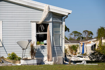 Wall Mural - Heavily damaged by hurricane houses in Florida mobile home residential area. Consequences of natural disaster