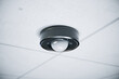 Advanced Ceiling-Mounted Motion Sensor in a High-Tech Office Space