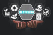© Satori Studio - Recycling concept, Businessman hands holding recycling icon on virtual screen.