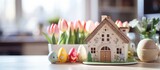Fototapeta Panele - Key to cozy home with Easter decorations on kitchen table Building design project moving to new home property