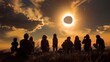 shadow of group of people watching a solar eclipse on a hill