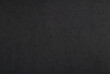 © Irina - A sheet of black cardboard texture as background