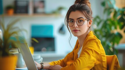 Woman works on a laptop