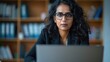 © Michael - Woman works on a laptop