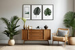 Stylish interior of living room with mock up poster frame, wooden commode, book, tropical leaf in ceramic vase and elegant personal accessories. Minimalist concept of home decor. Template.