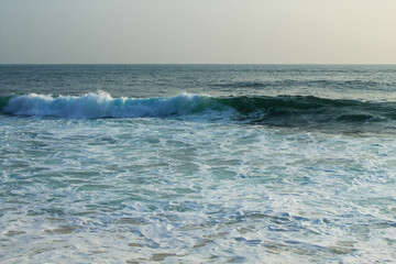 Wall Mural - Beach with golden sand and blue ocean water on most popular Unawatuna