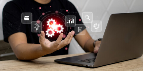 Fototapete - A Man using computer laptop working with ai to setting the system, Modern Technology Business.