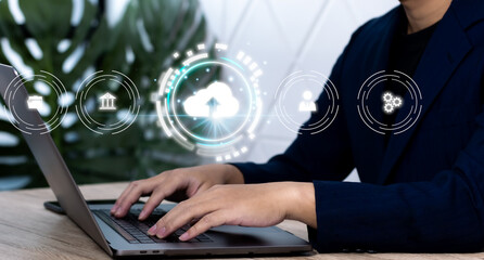 Fototapete - Businessman is using a laptop to access the cloud computing system, cloud computing, big data, business processes, various storage systems, internet of things