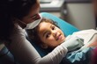 A moment of reassurance between a pediatric dentist and a child patient, a girl around 6 years old, of Hispanic descent, comforting her with a gentle touch while she sits apprehensive