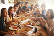 © YATrainer/peopleimages.com - Group, friends and party with fast food, celebration and diversity for joy or fun with youth. Men, Women and pizza with drink, social gathering and snack for lunch or eating at italian pizzeria