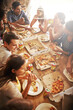© YATrainer/peopleimages.com - Group, friends and party with snack, pizza and diversity for joy or fun with youth. Men, Women and fast food with drink, social gathering and celebration for lunch or high angle at italian pizzeria