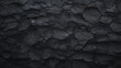 Detailed close up of a textured black asphalt surface