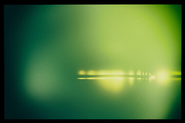 Wall Mural - Abstract blurry green background in a black frame and light horizontal lines.