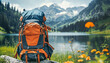 Backpack on a rock with alpine lake and flowers, mountains in the background.