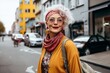 senior woman in glasses and hipster vintage stylish outfit in a street of berlin city or other European town