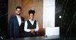 © ihorvsn - Portrait of polite, professional male and female workers of fancy hotel in uniform. Indian and African-American hotel managers smiling and looking into the camera. Customer care concept.