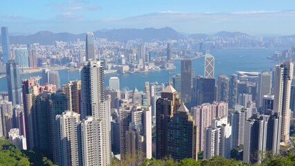 Wall Mural - Wonderful panoramic of Hong Kong city view from Victoria Peak, modern cityscape morning sinny day clouds.