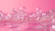 Gentle bubbles form on a pink surface, showcasing a delicate water texture and light play