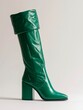 Green leather knee high boot.