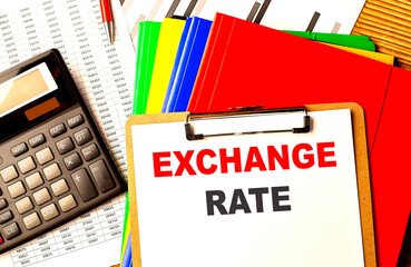 Poster - EXCHANGE RATE text written on paper clipboard with chart and calculator