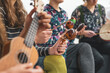 © Khaligo - Music therapy concept, a group of people playing different types of musical instruments, music healing