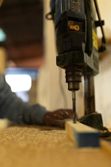 Wall Mural - man working in a carpentry shop. Photographs of the work and backgrounds for publications with copy space.