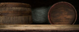 Fototapeta Tulipany - table background of free space for your wine bottle or food on top and dark retro interior of barrels . High quality photo