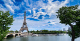 Fototapeta Paryż - Paris famous landmarks. Eiffel Tower iwith green tree over river, Paris France, web banner panorama