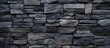 Background of stone blocks on a black wall