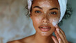 © Luluraschi - young brown skin woman cleansing her skin, skincare routine concept, fresh skin, clean, beauty
