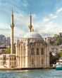 View from Bosphorus Strait overlooking Ortakoy Mosque, or Ortakoy Camii, aka Buyuk Mecidiye Camii, suited at the waterside of the Ortakoy pier square, Istanbul, Turkey