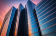 Modern corporate office building captured from a low angle during a vibrant sunset, symbolizing business success, growth, and future development