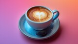 a cup of cappuccino on a saucer with a spoon on a pink and blue tablecloth.