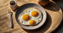 Capture an ultra-realistic image of two heart-shaped fried eggs on a sunlit breakfast table. Highlight the realistic play of natural light on the eggs, bringing out the colors and textur-AI Generative