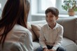 Boy opens up to his therapist in therapy about mental worries and needs 