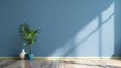 © Emma - blue wall empty room with green plant in vase
