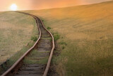 Fototapeta  - Golden Sunset Over Serene Countryside Railroad