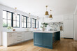 © Margaret Palmer/Stocksy - Blue Island Kitchen with Stone Backsplash