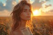 © svastix - Elegant young woman in a field at sunset, with a thoughtful expression on her face