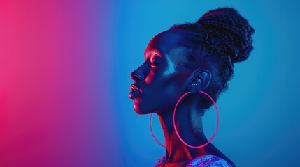 Wall Mural - Radiant Profile of a Woman with Hoop Earrings, woman presents a striking profile against a vibrant blue and pink backdrop, her large hoop earrings adding to her striking pose