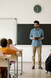© Oleksii Syrotkin/Stocksy - Pedagogue teaching class at school