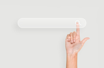 Finger presses the information search button on the button a virtual holographic interface. Search bar on a gray background. Businessman arm, hand presses the index finger on touch screen.