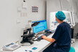 © VICTOR TORRES/Stocksy - Female medical personnel working on computer in laboratory.
